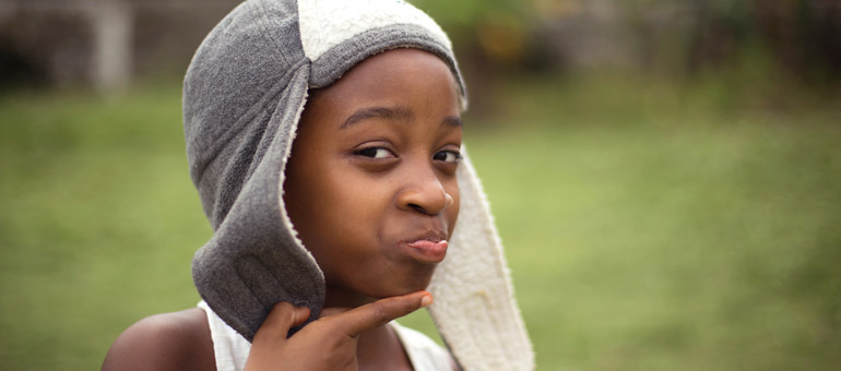 Girl wearing a funny hat and smiling