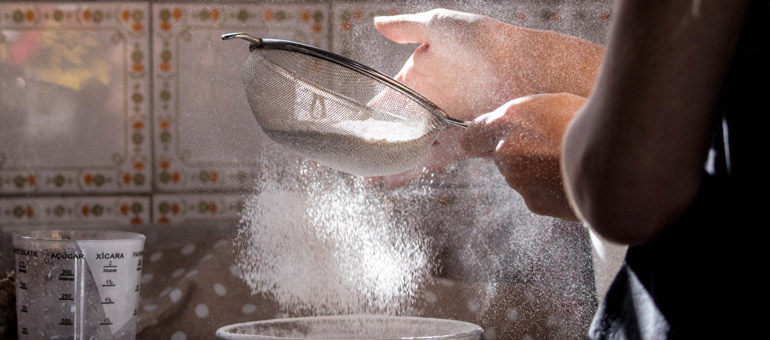 Woman cooking with flour